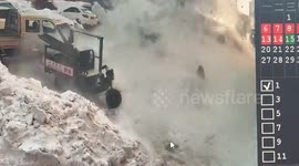 Chinese woman miraculously unharmed as slabs of snow plunge from rooftop