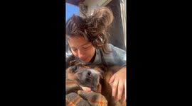 Woman Loves on Her Dying Dog
