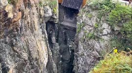 Waterfall slows backwards when wind blows droplets skywards