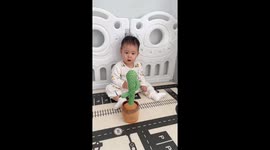 Adorable toddler startled by mimicking dancing cactus toy in Hebei, China