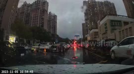Rainy day mishap: electric bicycle skid caught on camera in Jiangsu, China
