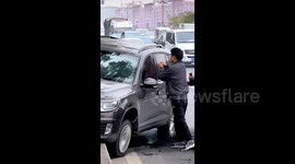 Heroic residents save unconscious driver after dramatic car crash in China