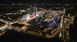 Aerial footage of opening night at popular Edinburgh Christmas Market in Princes Street Gardens, Edinburgh, Scotland