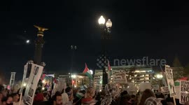 Pro-Palestinian protesters outside Union Station chant, “The people united, will never be defeated!”
