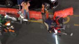 Two taxi motorcycles collide on a very busy street in Bangkok, Thailand.