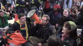 Palestine supporters hold sit-in protest at Waterloo station in London demanding 'ceasefire now'