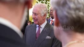 King cuts 75th birthday cake at afternoon tea in Highgrove in Gloucestershire, UK