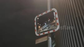 High winds near The Shard in London cause a mirror to wobbly greatly in the high wind