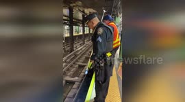 Taking Out Dropped Items on Subway Tracks in New York, USA