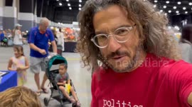 Father and son crack open geode at gem show in Florida