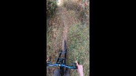 Biker trying to jump over a train track fails hard by crashing on the other side