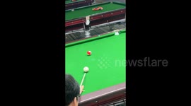 A Ball Struck To The Pocket Of Another Pool Table