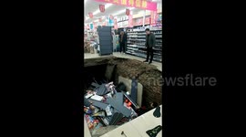 Terrifying moment floor collapses in newly-opened supermarket, injuring 2 in China
