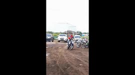 Attraction mishap: motorbike stunt ends in car bumper wreckage