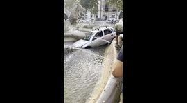 Woman Drives Her Car Into a Fountain