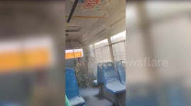 Bus passengers covered in SNOW as blizzard blows into vehicle
