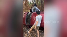 Motorcycle rider helps pull woman out of car accident wreckage