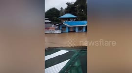 Residents stranded on roofs during severe flooding in the Philippines