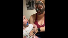 Adorable baby girl has her heart in her mouth after seeing paint on mummy's face