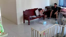Girl falls off chair and grandpa catches her in time CCTV