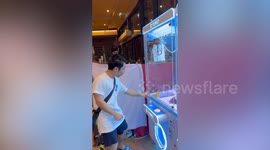 Man thinks he won at the claw machine... but the prize gets stuck inside