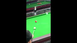 Impressive cue shot sends ball flying to another table