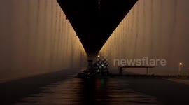 Evening rain cascading down Chinese bridge makes mesmerising view
