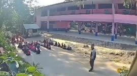 Schoolchildren scatter as crazed sickle-wielding man rampages through school in Thailand