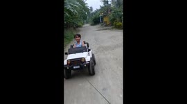 Stray dogs chase after boy in electric toy car
