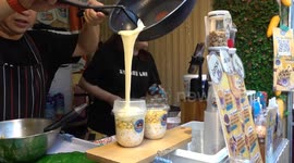 Corn with melted cheese is a hit at street food market in Bangkok