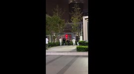 Two girls crash into each other while skateboarding off ledge