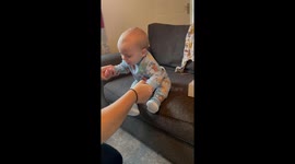 11 Months Old baby tries on shoes for the first time *Hilariously Cute Reaction*