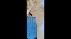 Dramatic moment man rescued from burning building in UK by crane