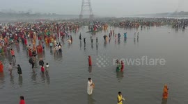 Drone visuals of thousands of devotees taking holy dip in polluted Yamuna river during Chhath Puja