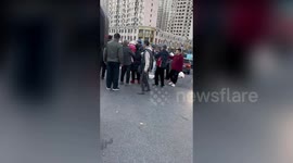 Lost deer mixes with crowd on road in China