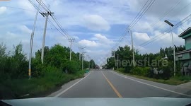 Lorry overturns and stops inches from oncoming car