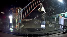 Woman's jacket accidentally snagged as barrier gate lifts in China