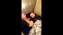 Woman pranks sleeping partner by putting their baby's bottle in his mouth