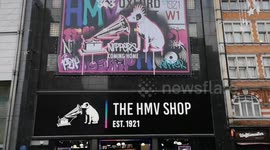HMV In Oxford Street gets ready to reopen on its original site on Black Friday. 2 hours before it opened it already had a queue of 4 people