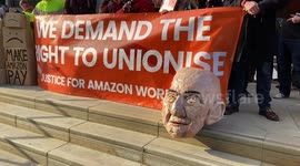 Amazon workers stage Black Friday protest over pay outside Amazon offices in London