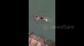 Heroic swimmer and police officer team up to save drowning man from lake in China