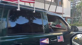 Israel Supporter Trump supporter drives through Waikiki hawaii with flags of trump and Israel