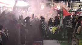 Protesters set off smoke bombs in Palestine flag colours during demonstration in London