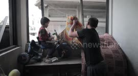 Palestinian citizens inspect their homes that were bombed by Israeli aircraft In Bureij camp, central Gaza Strip