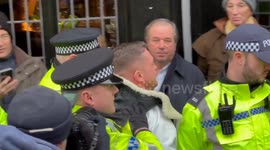 Tommy Robinson arrested as thousands gathered for march against anti-semitism outside Royal Courts of Justice