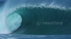 Thrills, spills and epic ocean swell as surfers brave 50ft waves in Hawaii on Black Friday
