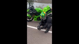 Biker Shares Snacks With Squirrel