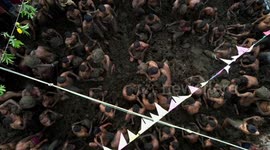 Drone gets birds-eye-view of Indian villagers celebrating cow dung festival by throwing muck at each other