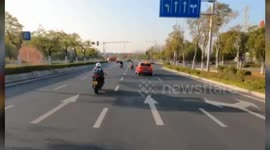 Shocking moment driver makes sharp left turn and hits motorcycle rider