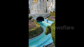 Shocking moment Disneyland tourist strips naked and jumps into ride's stream